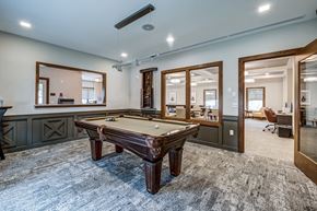 Mercerville apartment for rent - A room with a pool table and a mirror.