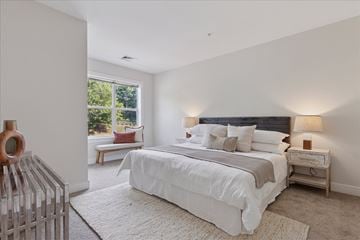 Palmer Township apartment for rent - A bedroom with a large bed and a window seat.