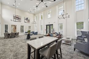 Langhorne apartment for rent - A large dining room with a long table and chairs.