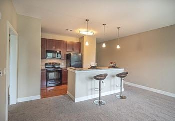 Fitted kitchen with island dining