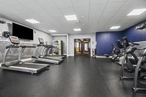 Grandville apartment for rent - A gym with treadmills and exercise equipment.
