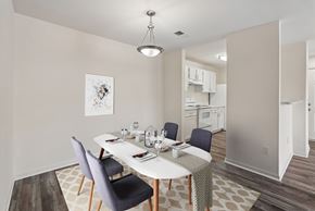Herndon apartment for rent - A dining room with a white table and chairs.