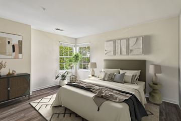 Herndon apartment for rent - A bedroom with a large bed and a window.