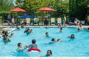 Ashburn apartment for rent - A group of people are swimming in a pool.