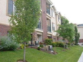Taylorsville apartment for rent - an apartment building with a lawn and trees