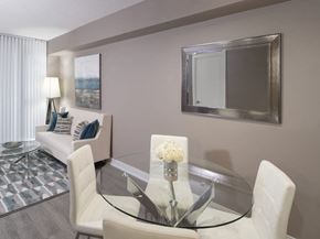 Etobicoke apartment for rent - a living room filled with furniture and a large mirror