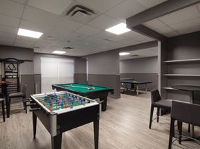 North York apartment for rent - a games room with two pool tables and a ping pong table