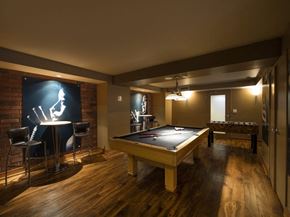 Toronto apartment for rent - a game room with a pool table and a foosball table