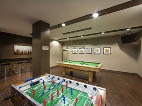 Etobicoke apartment for rent - a games room with a foosball table and a ping pong table