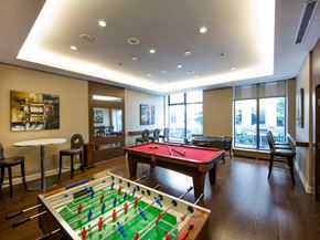 Etobicoke apartment for rent - a game room with a foosball table and a ping pong table