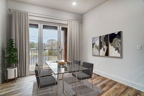 Belmont apartment for rent - a dining room with a glass table and chairs