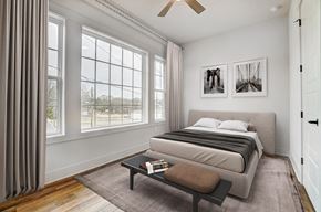 Belmont apartment for rent - a bedroom with a bed and a large window