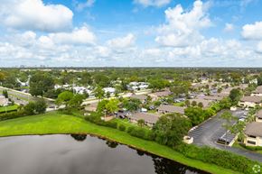 Orlando apartment for rent - A lake in front of a residential area.