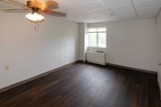 Roanoke apartment for rent - A room with a ceiling fan and a window.