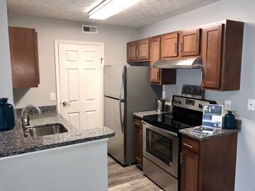 Westerville apartment for rent - a kitchen with granite counter tops and stainless steel appliances
