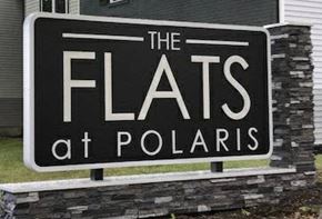 Westerville apartment for rent - a sign for the flats at polaris in front of a house