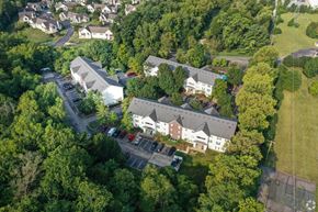 Delaware apartment for rent - A bird's eye view of a residential area with houses and parked cars.