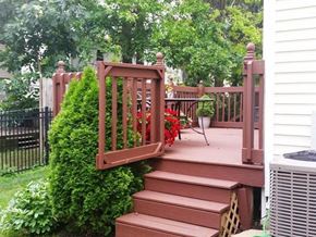 Worthington townhouse for rent - a deck with a wooden railing and stairs