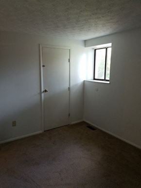 Westerville triplex for rent - a white room with a window and a door