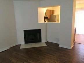 Worthington apartment for rent - a living room with a fireplace and wooden floors