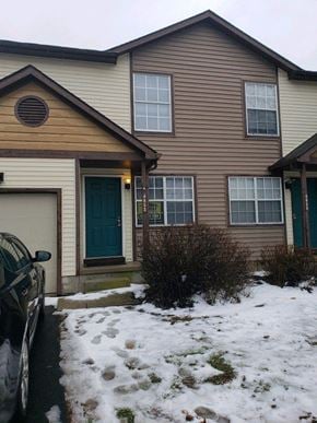 Hilliard townhouse for rent - a house with a car parked in the snow