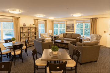 Salem apartment for rent - A well-lit living room with a dining table and chairs.