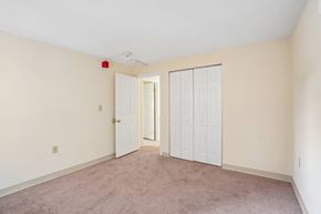 Seabrook apartment for rent - A room with a carpeted floor and two doors.