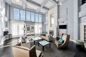 Woburn apartment for rent - A living room with a fireplace and a large window.