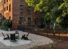 Boston apartment for rent - a yard with two chairs and a brick building