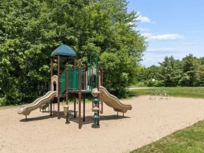 Seabrook apartment for rent - A playground with a green slide and a brown slide.