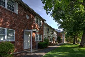 Leominster apartment for rent - A red brick building with a white door and windows.