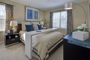 Hooksett apartment for rent - a bedroom with a bed and a dresser and a window