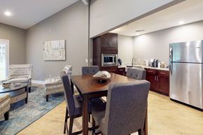 Summerville apartment for rent - A modern kitchen with a dining table and chairs.