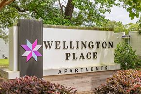Summerville townhouse for rent - A sign for Wellington Place Apartments is shown in front of a building.
