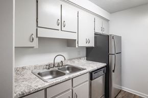 Summerville townhouse for rent - A kitchen with a sink and a refrigerator.