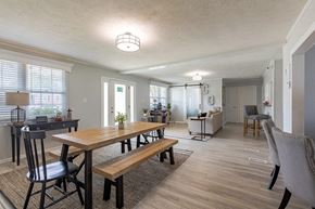 Fayetteville apartment for rent - A dining room with a wooden table and chairs.
