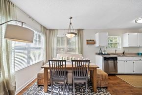Bluffton apartment for rent - A dining room with a table set for two.