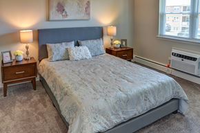 Allentown apartment for rent - A bedroom with a large bed and a window.