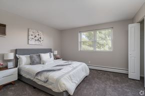 Pottstown apartment for rent - A bedroom with a large bed and a window.