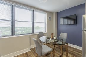 Philadelphia apartment for rent - A dining room with a glass table and chairs.