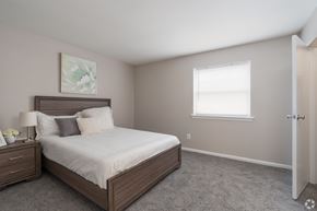Glassboro apartment for rent - A bedroom with a large bed and a window.