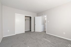Pottstown apartment for rent - A room with two white doors and a carpeted floor.
