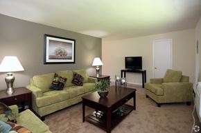 Secane apartment for rent - A living room with a couch, chair, and television.