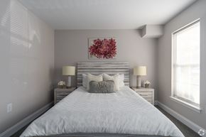 Allentown apartment for rent - A bedroom with a large bed and two lamps.
