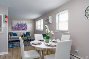 Bensalem apartment for rent - A dining room with a white table set for two.