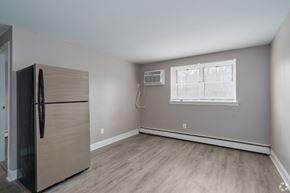 Bensalem apartment for rent - A kitchen with a refrigerator and a window.