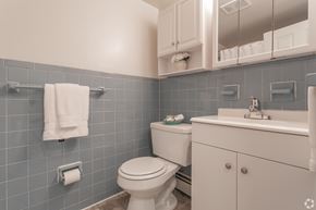 Newark apartment for rent - A white toilet sits next to a sink in a bathroom.