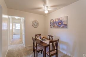Newark apartment for rent - A dining room with a wooden table and chairs.