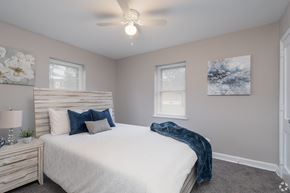 Allentown apartment for rent - A bedroom with a large bed and a ceiling fan.