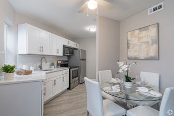 Allentown apartment for rent - A modern kitchen with a glass dining table set for four.